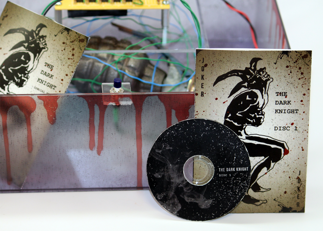 The Dark Knight disc sleeves and stop button inside the collector's edition box
