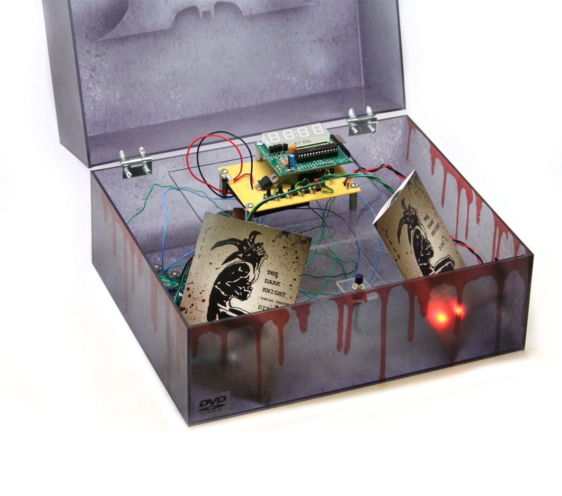 The Dark Knight collector's edition box open, showing the timer wired into the lid